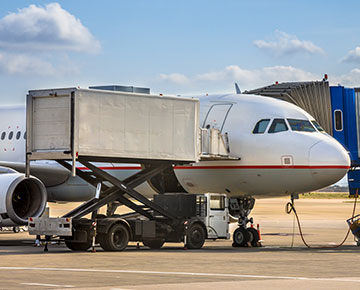 airplane being loaded with freight for transportation